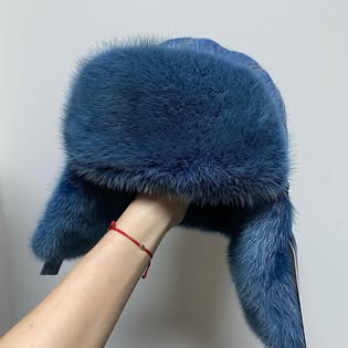 Blauwe KORANSO-muts met bontdetails